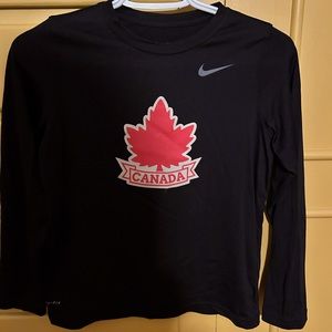 Nike Athletics Canada dry fit long sleeve shirt. Size youth M. Never worn.